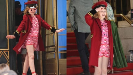 Mae Schenk wears a red ensemble to film scenes outside the Plaza Hotel for ELOISE