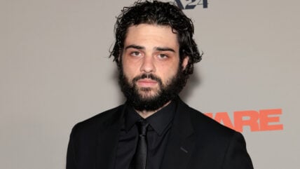 Noah Centineo in a black suit at A24 film premiere