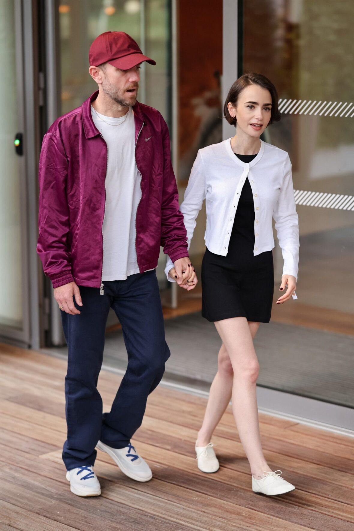 Lily Collins and Charlie McDowell pose at French Open