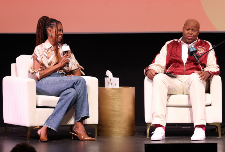 Michelle Obama and Craig Robinson speak on stage