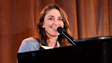 Sara Bareilles performing at piano